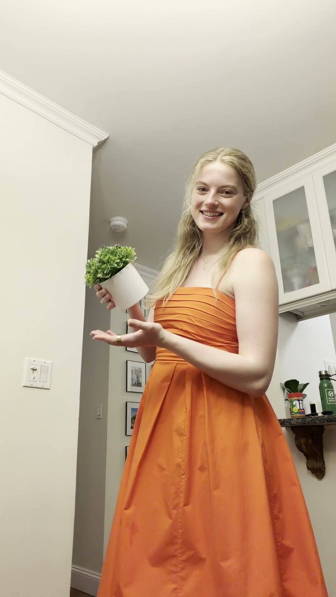 Creator in an orange dress